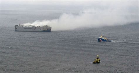 High winds stall efforts to tow a burning cargo ship packed with cars off northern Dutch coast